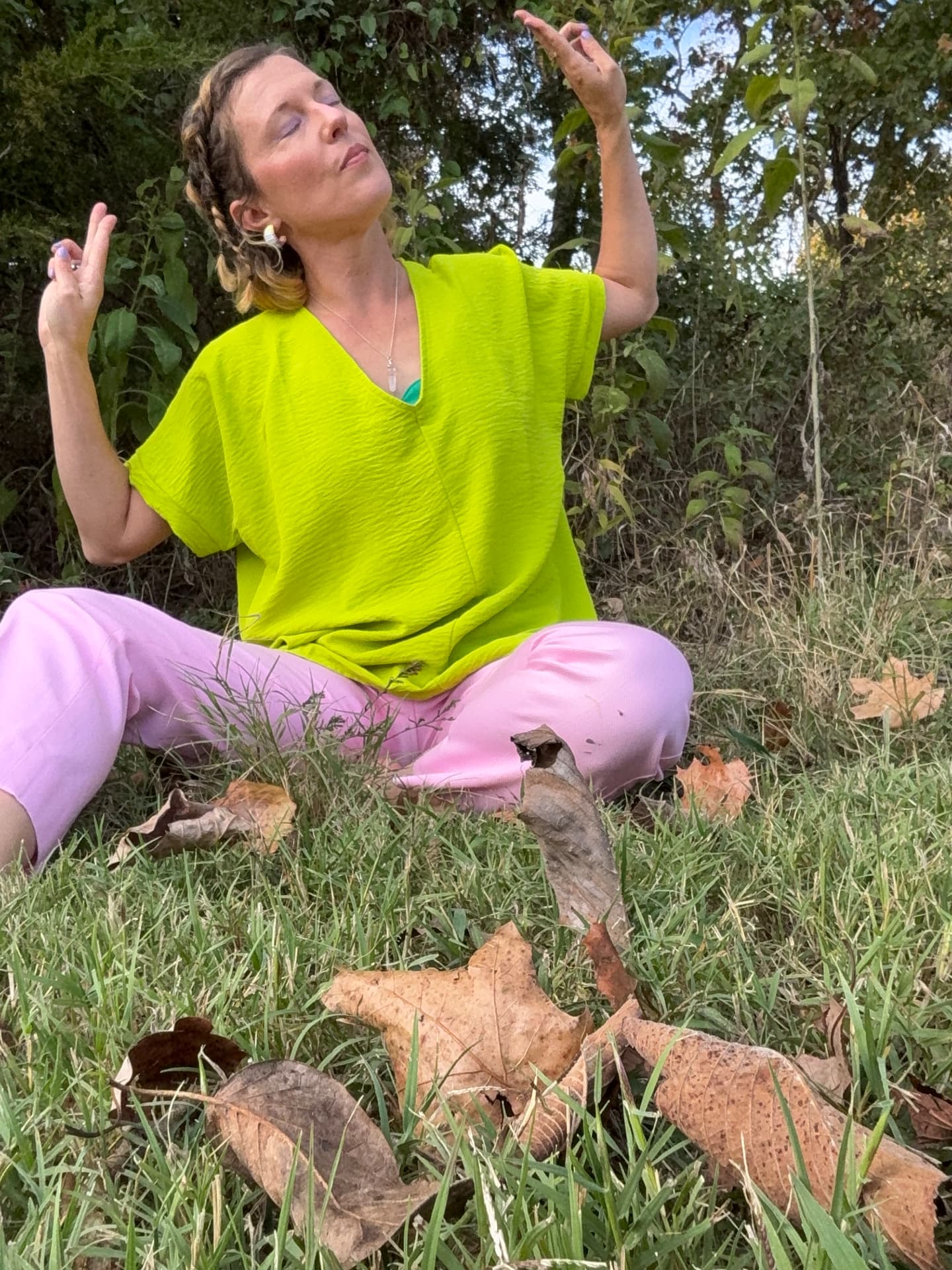 Hazel meditating in the grass