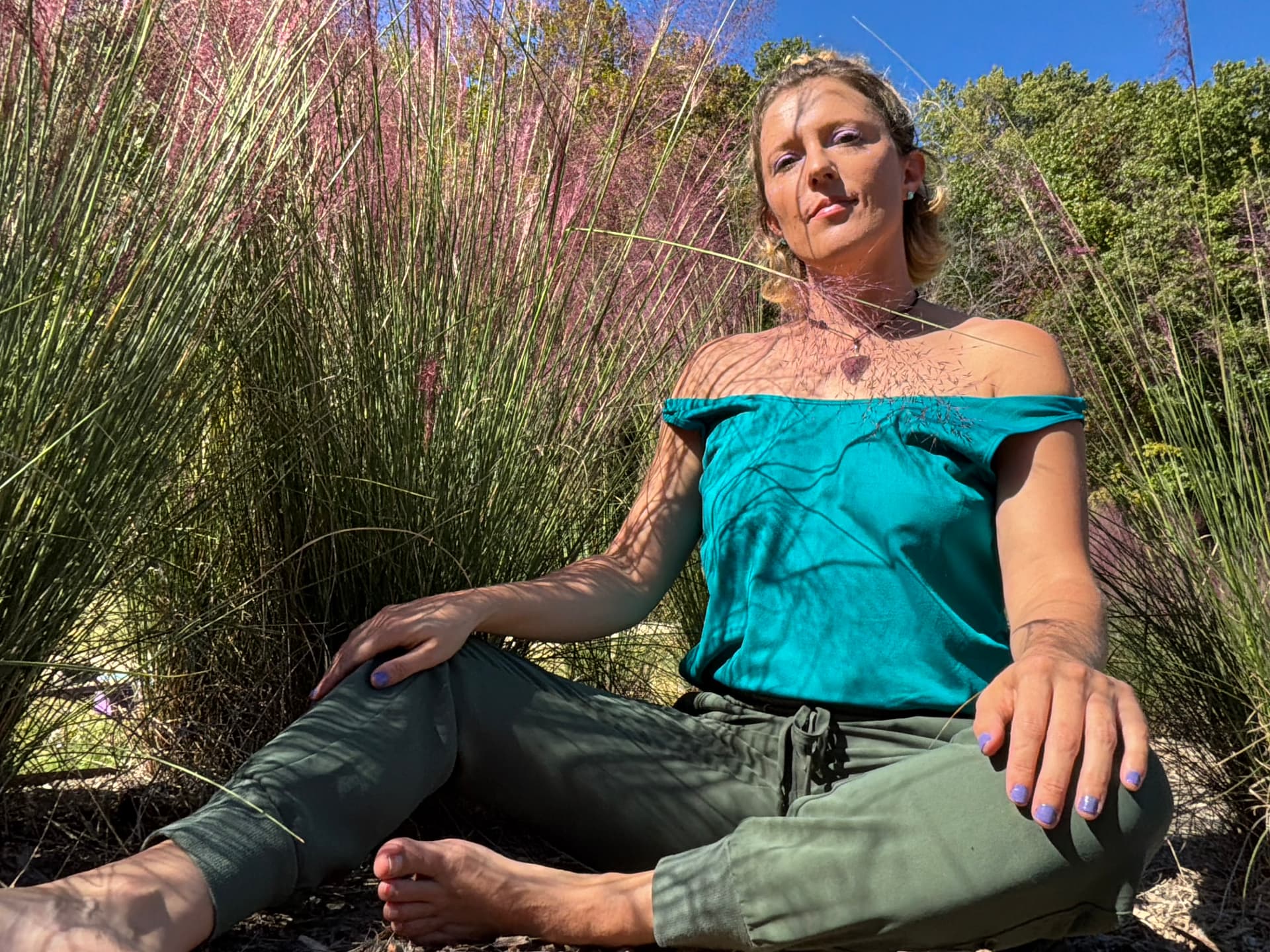 Hazel seated among pink grasses